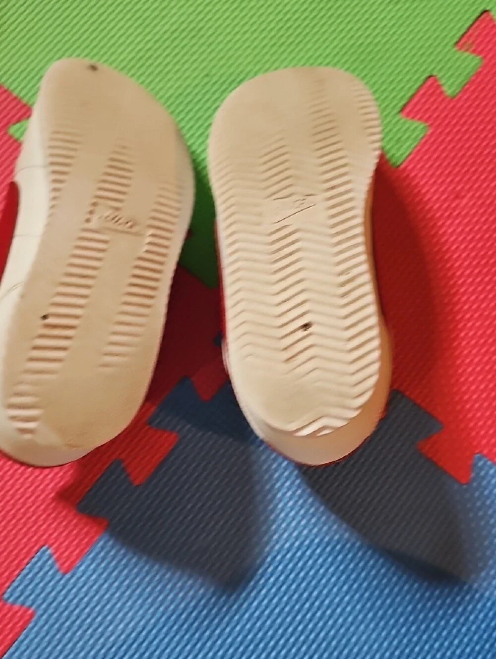 Nike Kids Cream Sneakers with Red Swoosh and Blue Accent